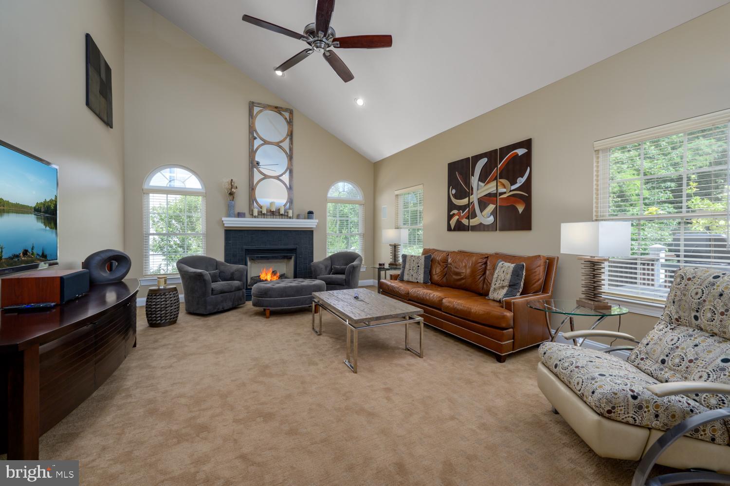 11 Gaskill Road Mount Laurel, NJ 08054 - Photo 24 of 56 a living room with furniture a fireplace and a large window