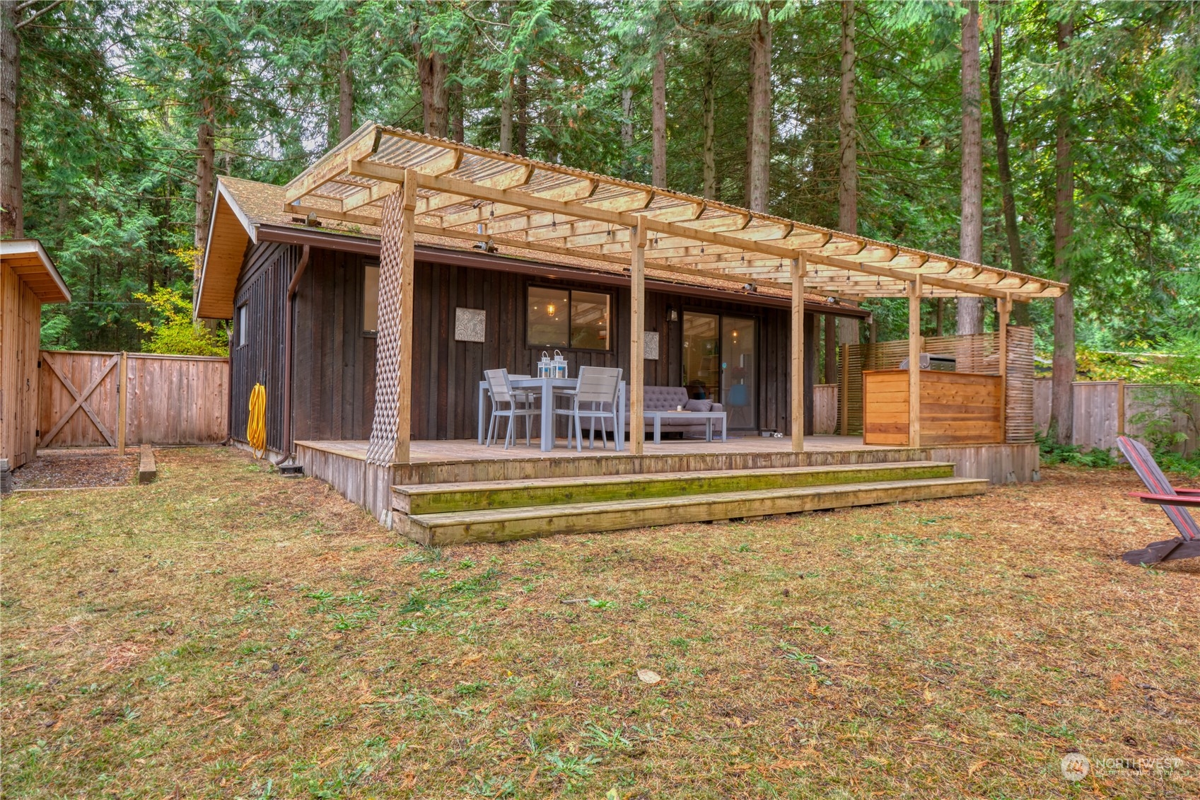 1976 Johnson Road Point Roberts, WA 98281 - Photo 2 of 22 a view of a house with a backyard patio and balcony