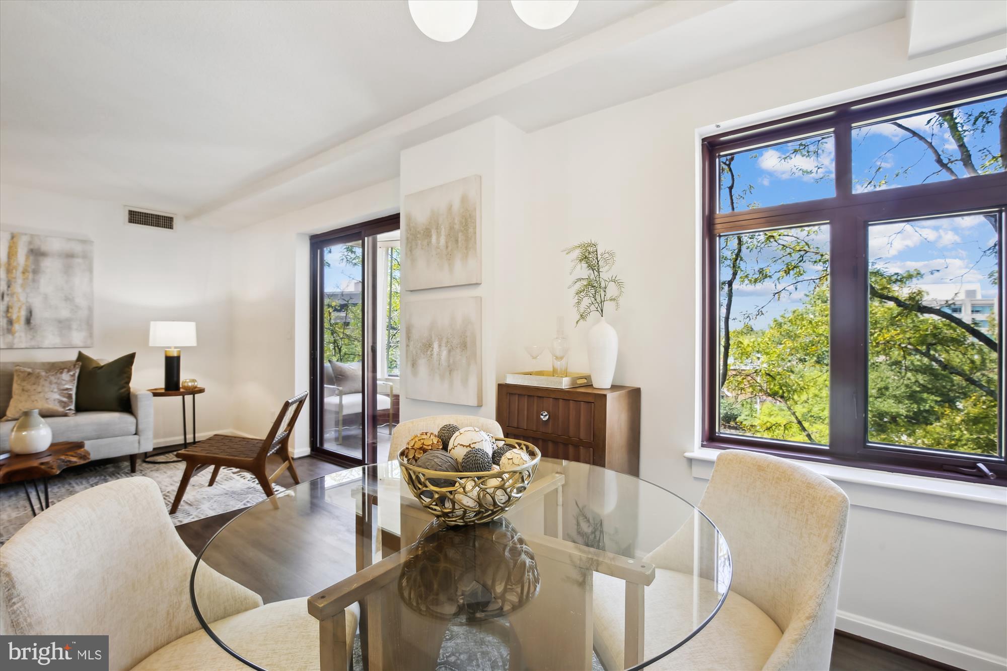 2400 Clarendon Boulevard, Unit 414 Arlington, VA 22201 - Photo 12 of 39 a living room with furniture and floor to ceiling windows
