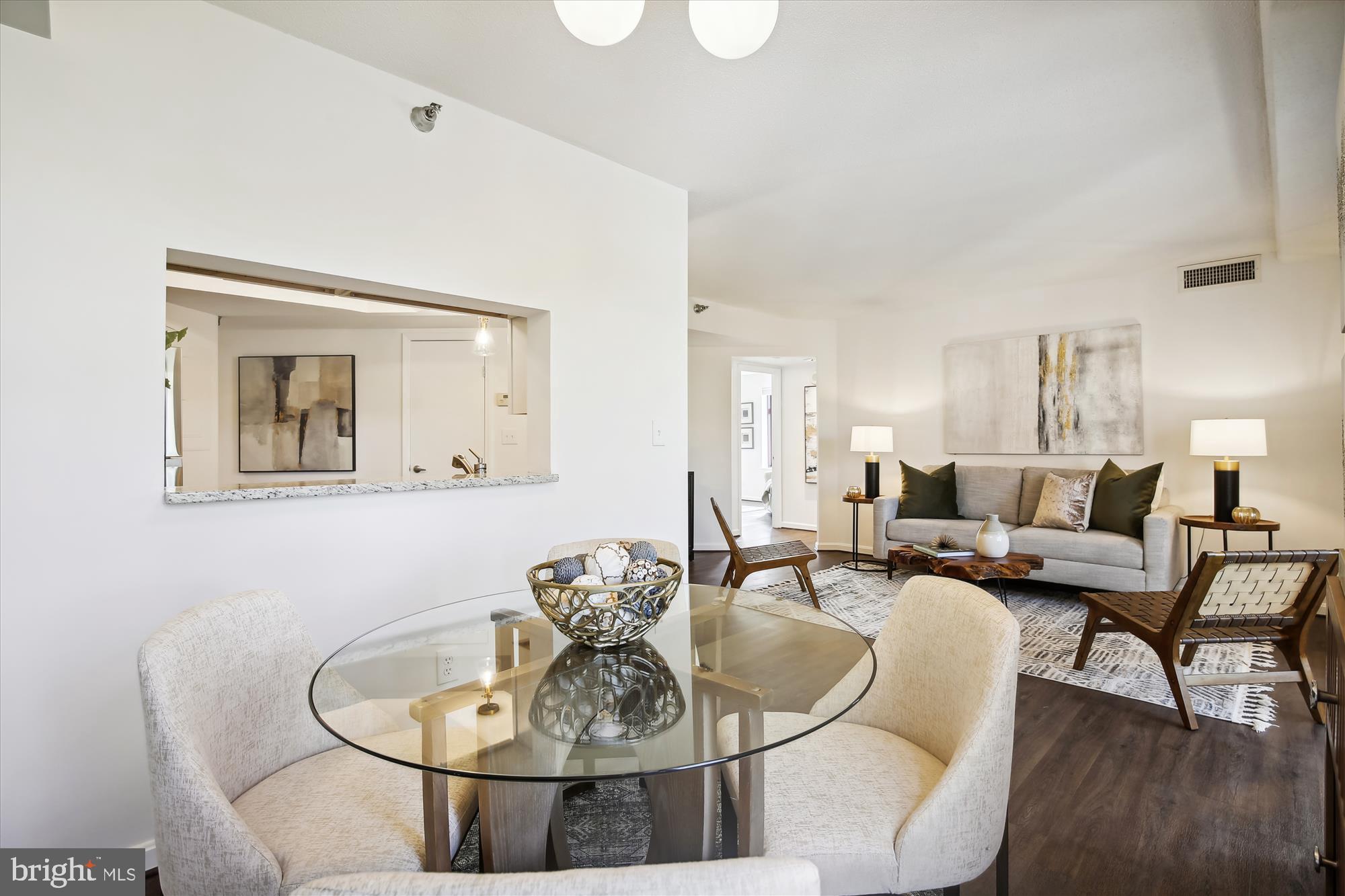 2400 Clarendon Boulevard, Unit 414 Arlington, VA 22201 - Photo 17 of 39 a living room with furniture and a wooden floor