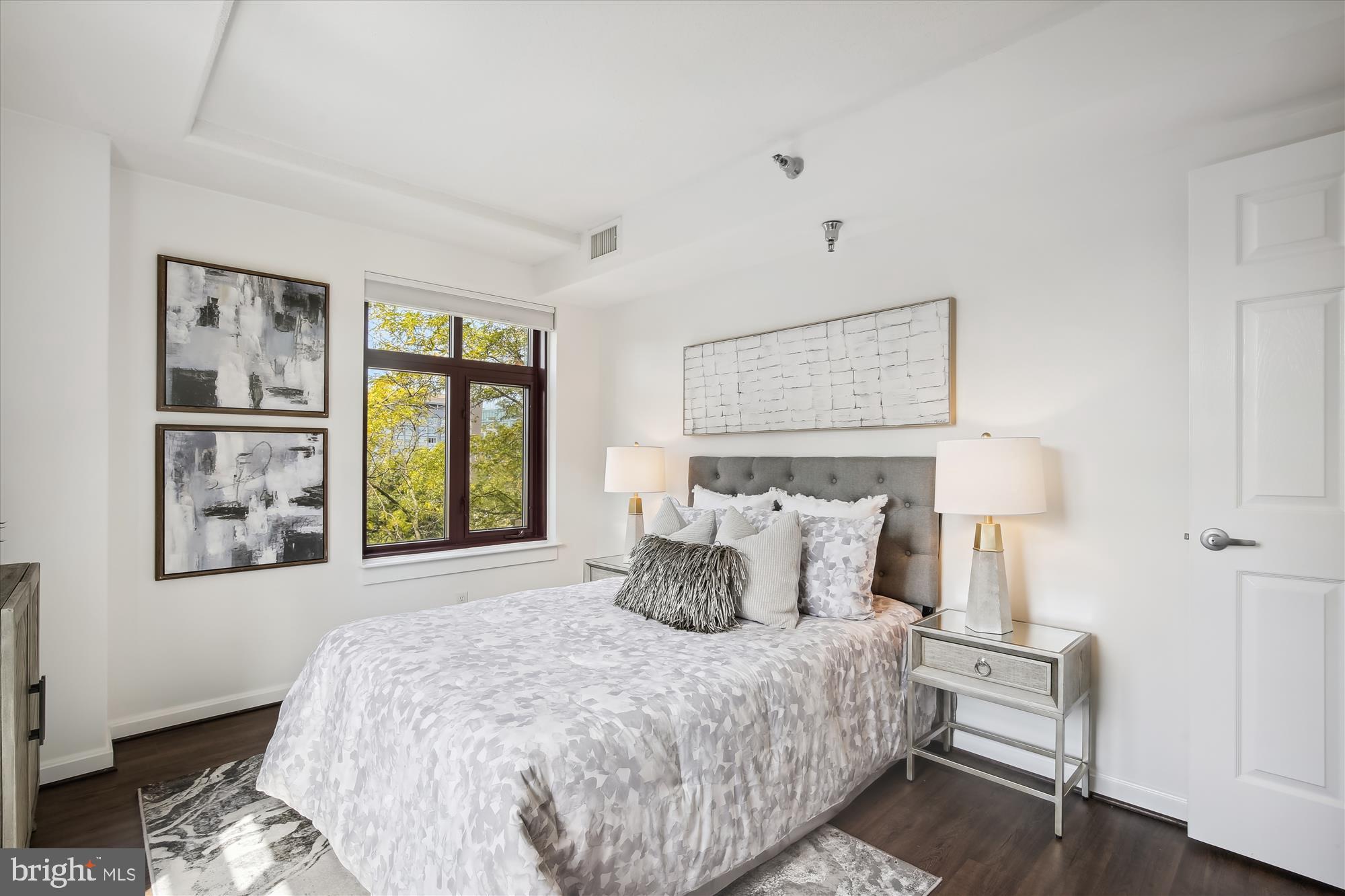 2400 Clarendon Boulevard, Unit 414 Arlington, VA 22201 - Photo 19 of 39 a bedroom with a bed and a window