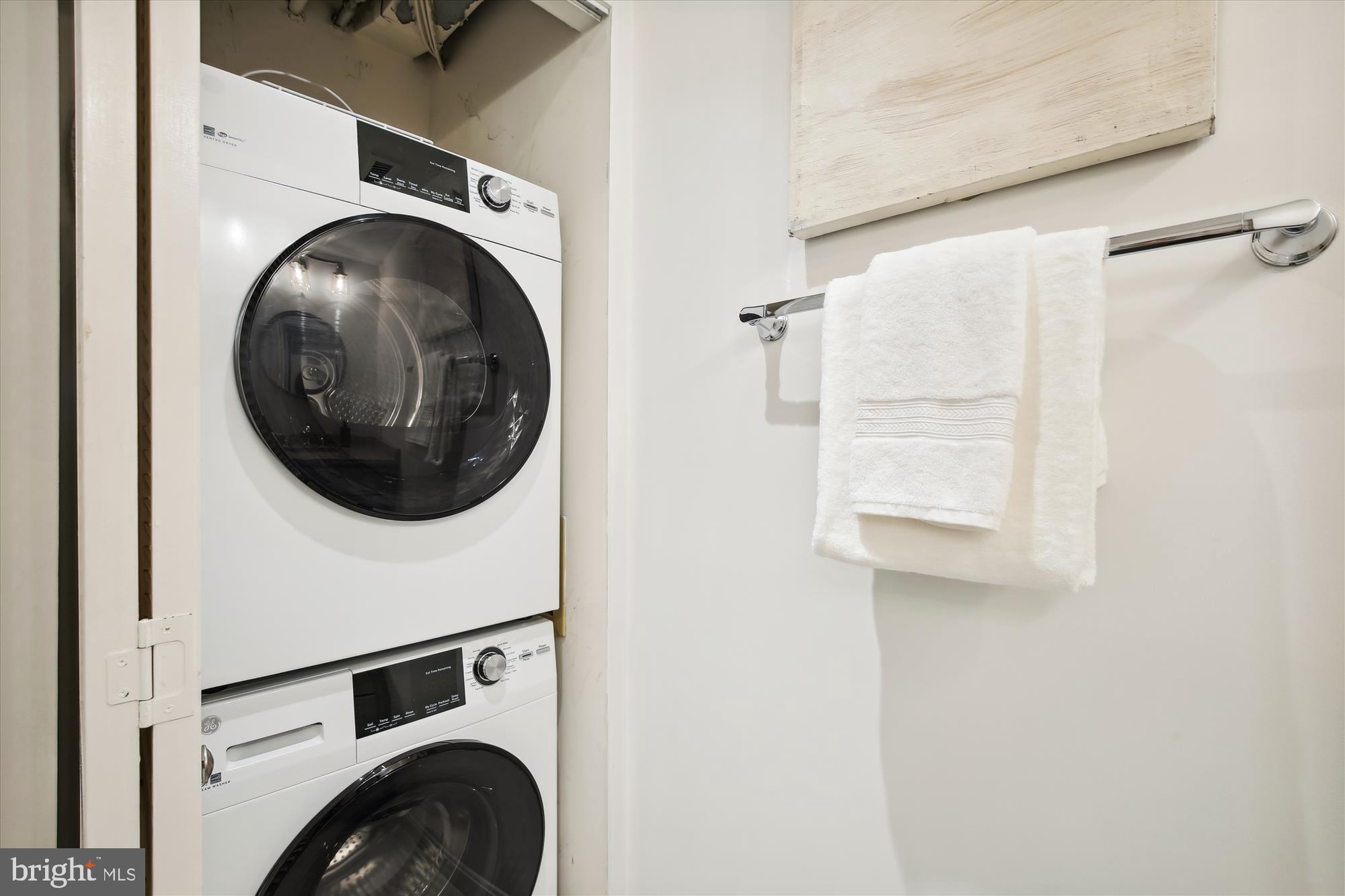 2400 Clarendon Boulevard, Unit 414 Arlington, VA 22201 - Photo 22 of 39 a view of a hallway with washer and dryer