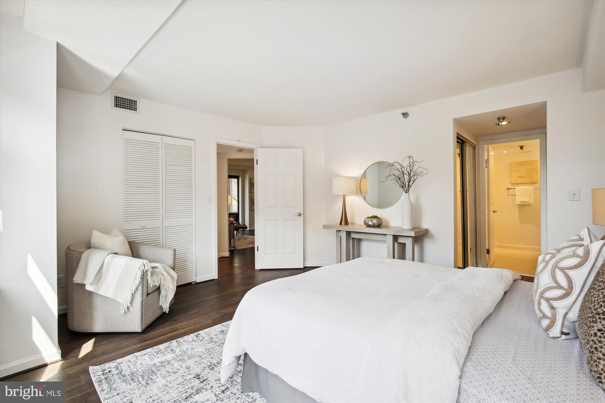 2400 Clarendon Boulevard, Unit 414 Arlington, VA 22201 - Photo 26 of 39 a bedroom with a bed large window and couch