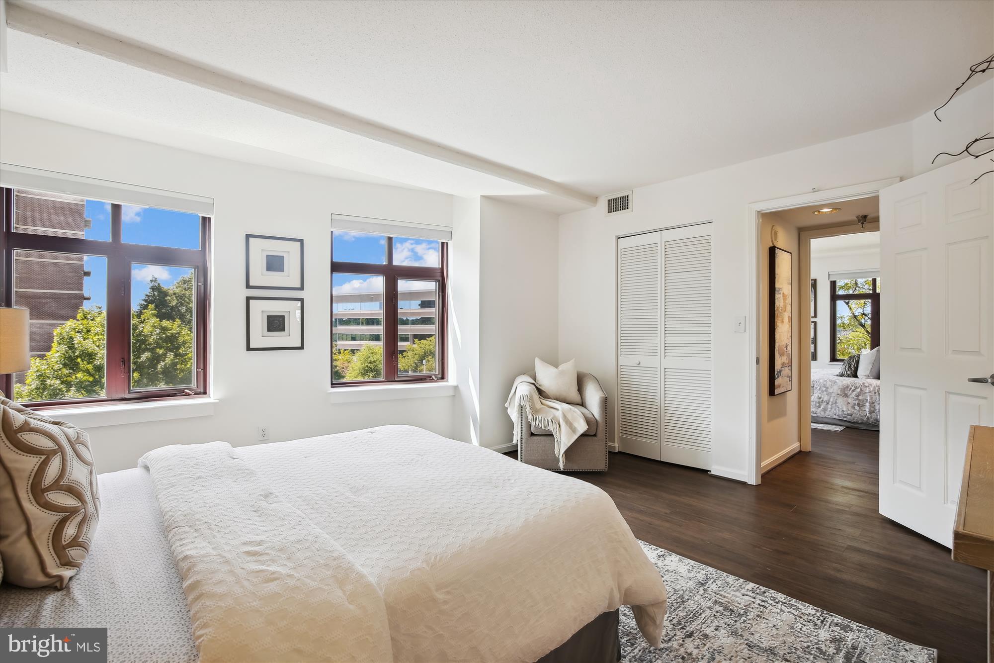 2400 Clarendon Boulevard, Unit 414 Arlington, VA 22201 - Photo 27 of 39 a spacious bedroom with a bed and wooden floor