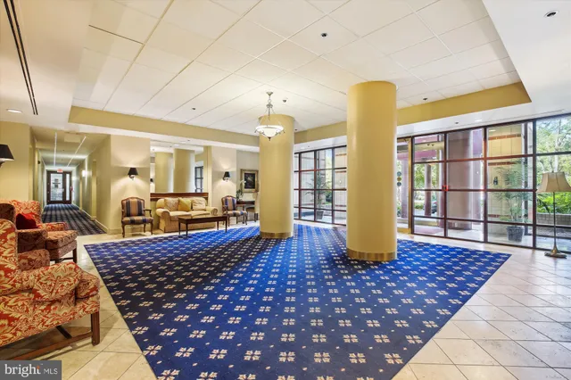a view of a swimming pool with a lounge chair