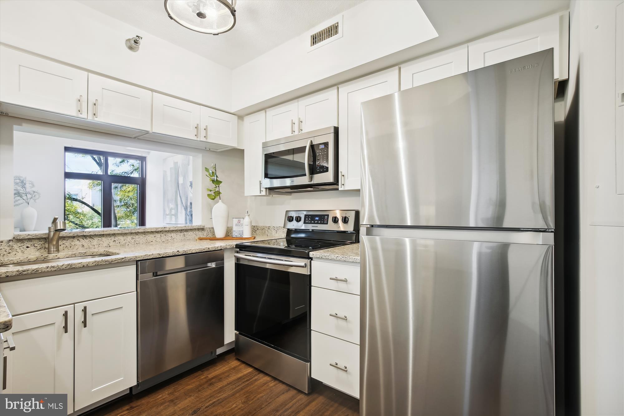 2400 Clarendon Boulevard, Unit 414 Arlington, VA 22201 - Photo 7 of 39 a kitchen with a refrigerator sink and microwave