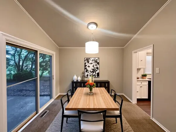 a view of a dining room with furniture window and outside view