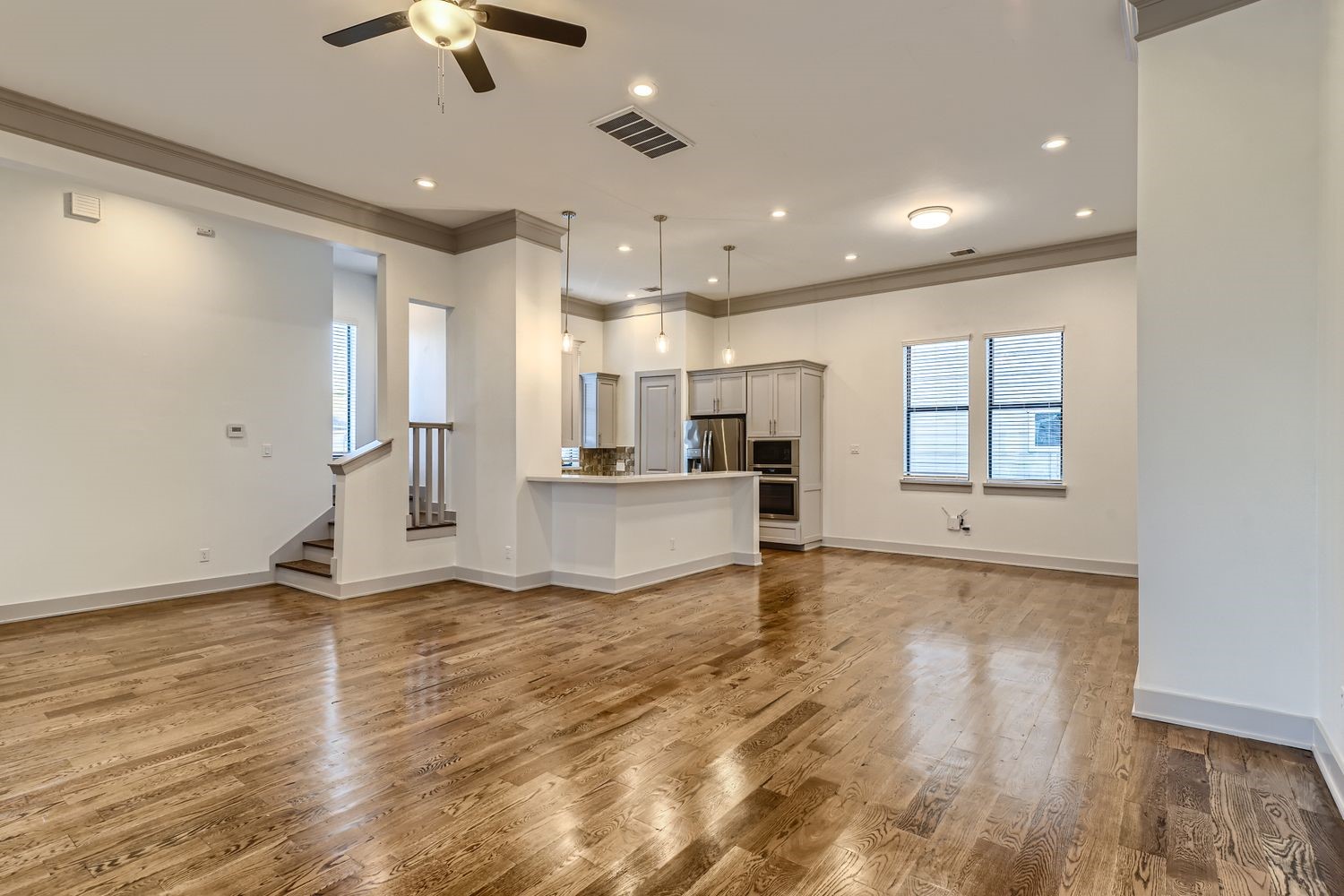 2208 Arabelle Street Houston, TX 77007 - Photo 1 of 26 a view of empty room with wooden floor and window