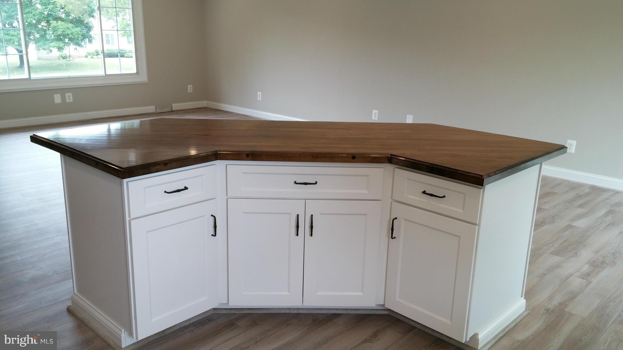 24411 Morgan Road Hollywood, MD 20636 - Photo 11 of 28 a kitchen with granite countertop white cabinets and a sink