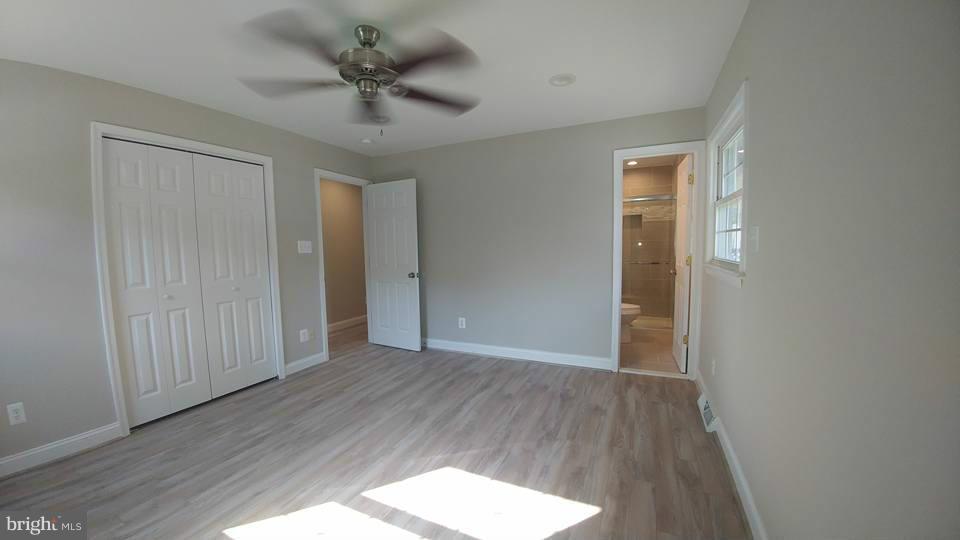 24411 Morgan Road Hollywood, MD 20636 - Photo 17 of 28 wooden floor in an empty room with a window