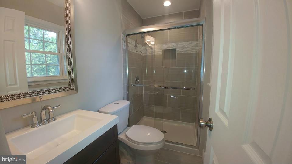 24411 Morgan Road Hollywood, MD 20636 - Photo 18 of 28 a bathroom with a sink toilet and shower