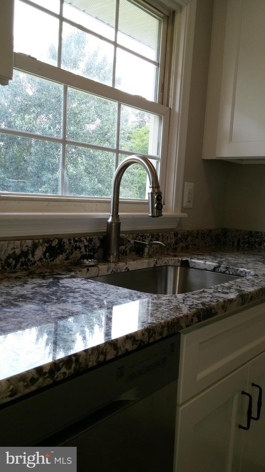 24411 Morgan Road Hollywood, MD 20636 - Photo 7 of 28 a close view of a sink a stove and a window