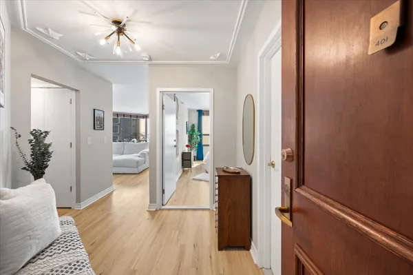 a living room with furniture and a glass door