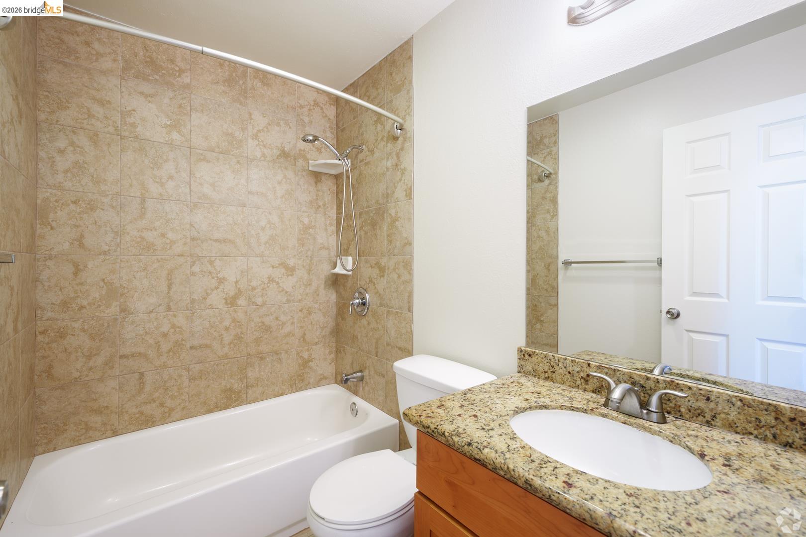 900 Alvarez Avenue Pinole, CA 94564 - Photo 10 of 10 a bathroom with a granite countertop sink toilet tub and shower