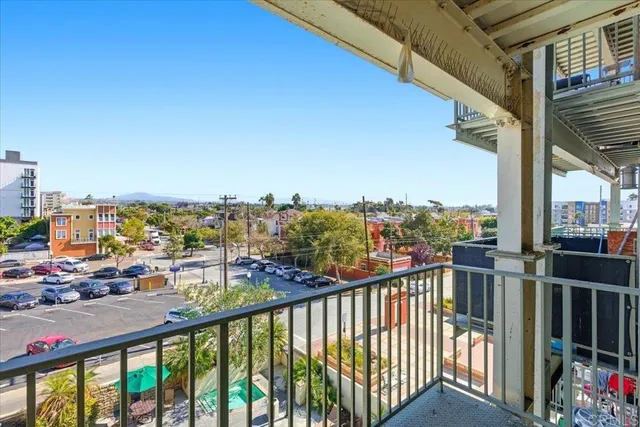 a view of a balcony with city view