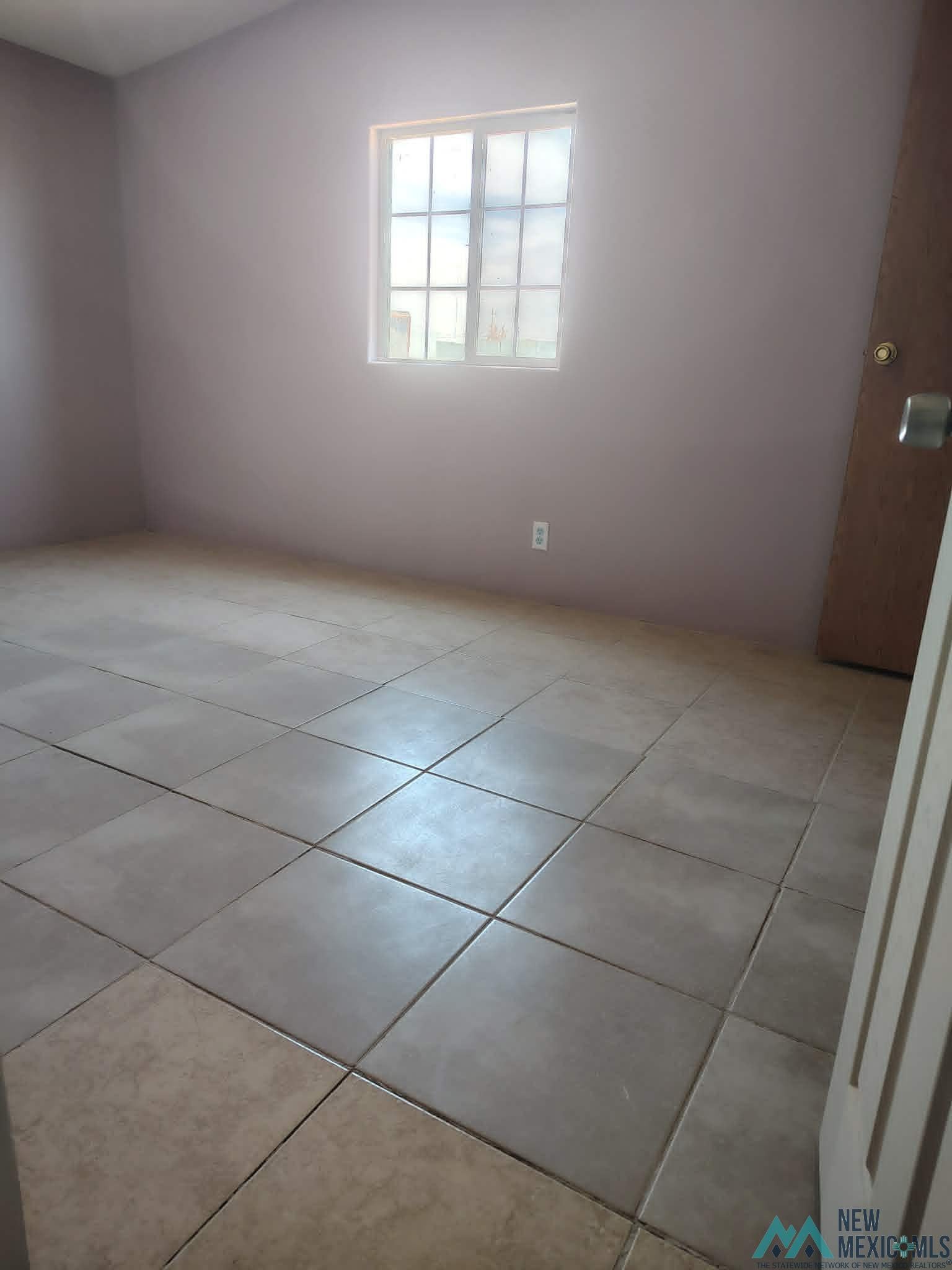 58 Fisk Road Dexter, NM 88230 - Photo 12 of 46 Square tile flooring extending throughout a neutral-toned room