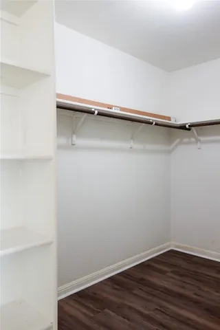 a view of an empty walk in closet