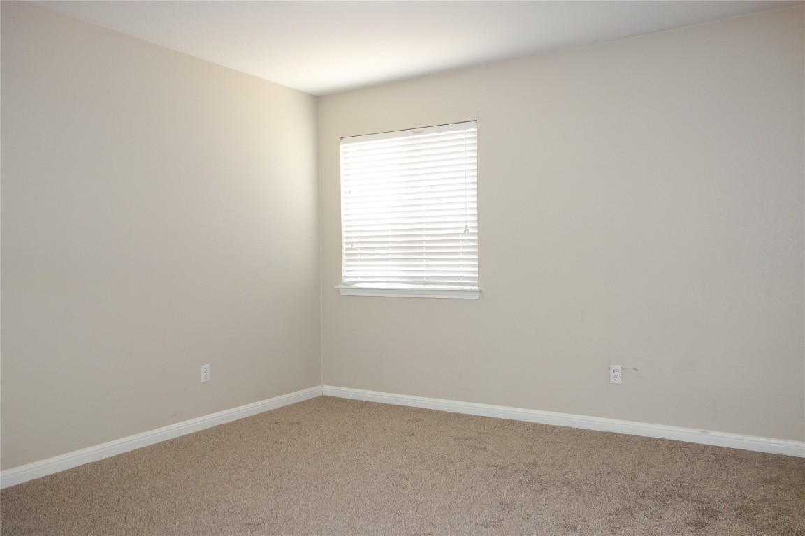 108 Lavaca Loop Hutto, TX 78634 - Photo 23 of 39 an empty room with a window