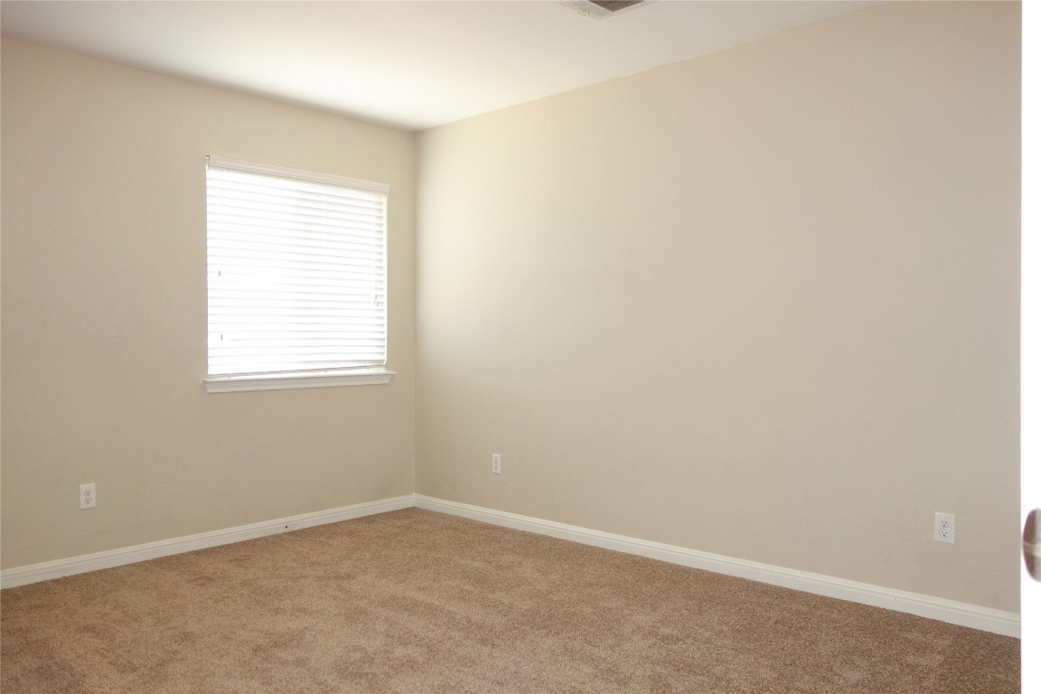 108 Lavaca Loop Hutto, TX 78634 - Photo 24 of 39 an empty room with a window