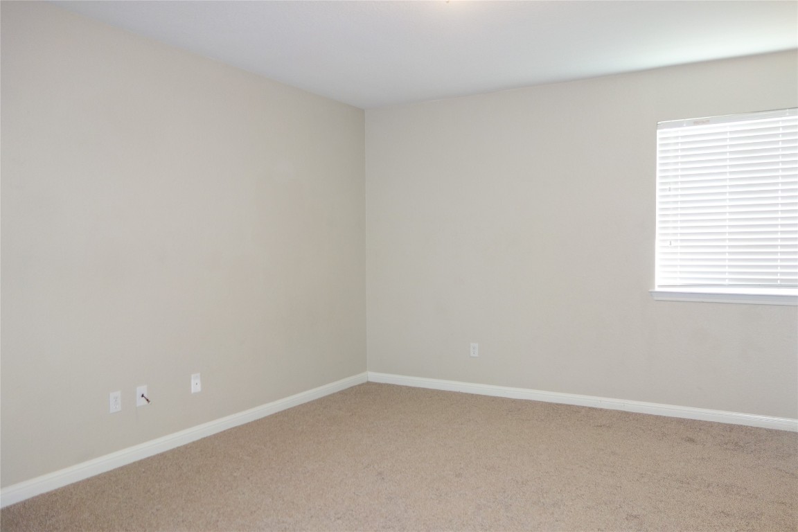 108 Lavaca Loop Hutto, TX 78634 - Photo 25 of 39 an empty room with a window