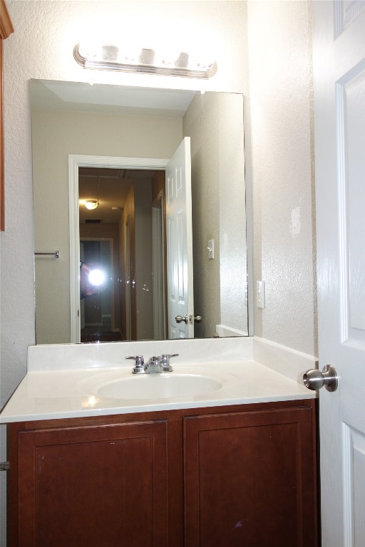 108 Lavaca Loop Hutto, TX 78634 - Photo 28 of 39 a bathroom with a sink and a mirror
