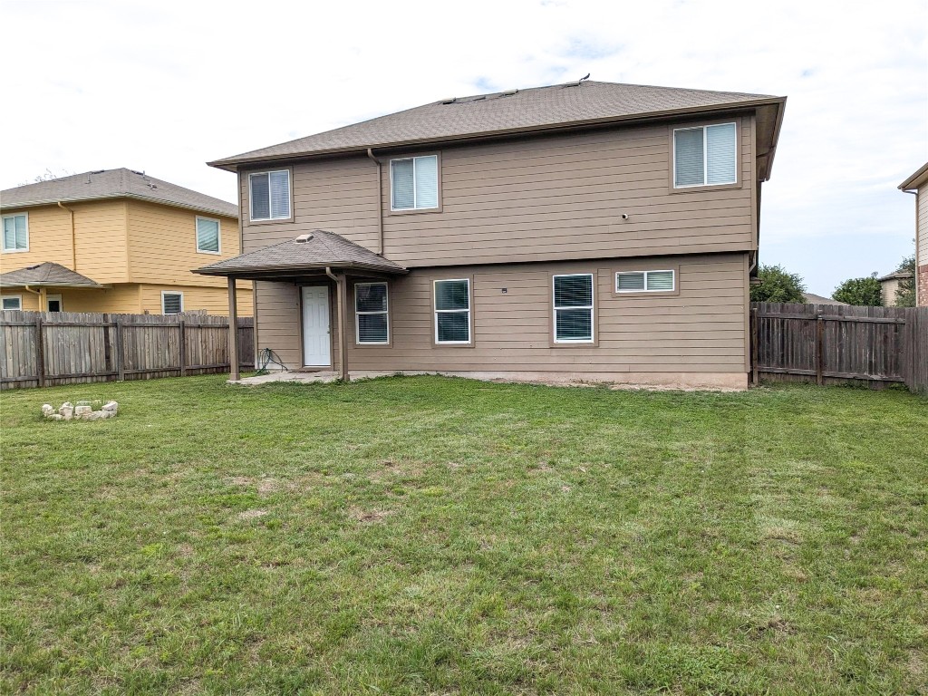 108 Lavaca Loop Hutto, TX 78634 - Photo 34 of 39 a front view of a house with a garden