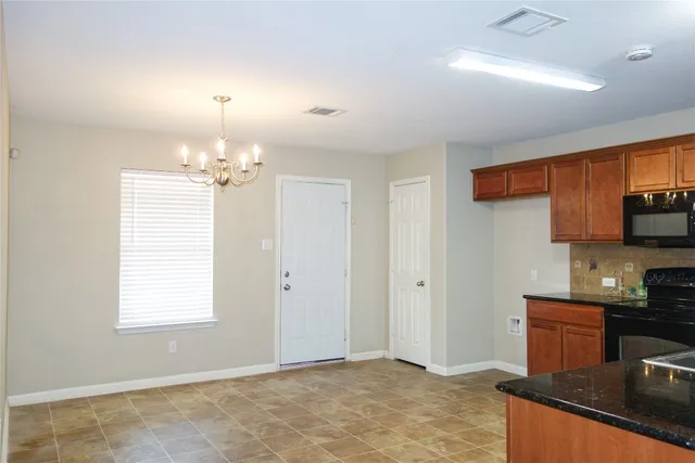a view of a kitchen with granite countertop cabinets and a sink