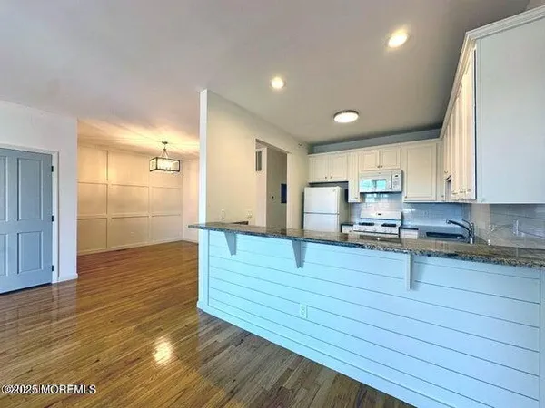 a view of kitchen with wooden floor