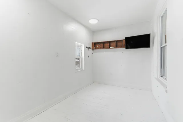 a view of room with a flat screen tv