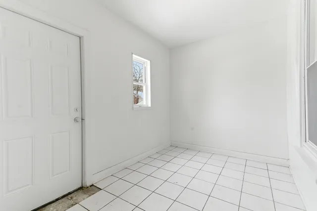 a view of an empty room and window