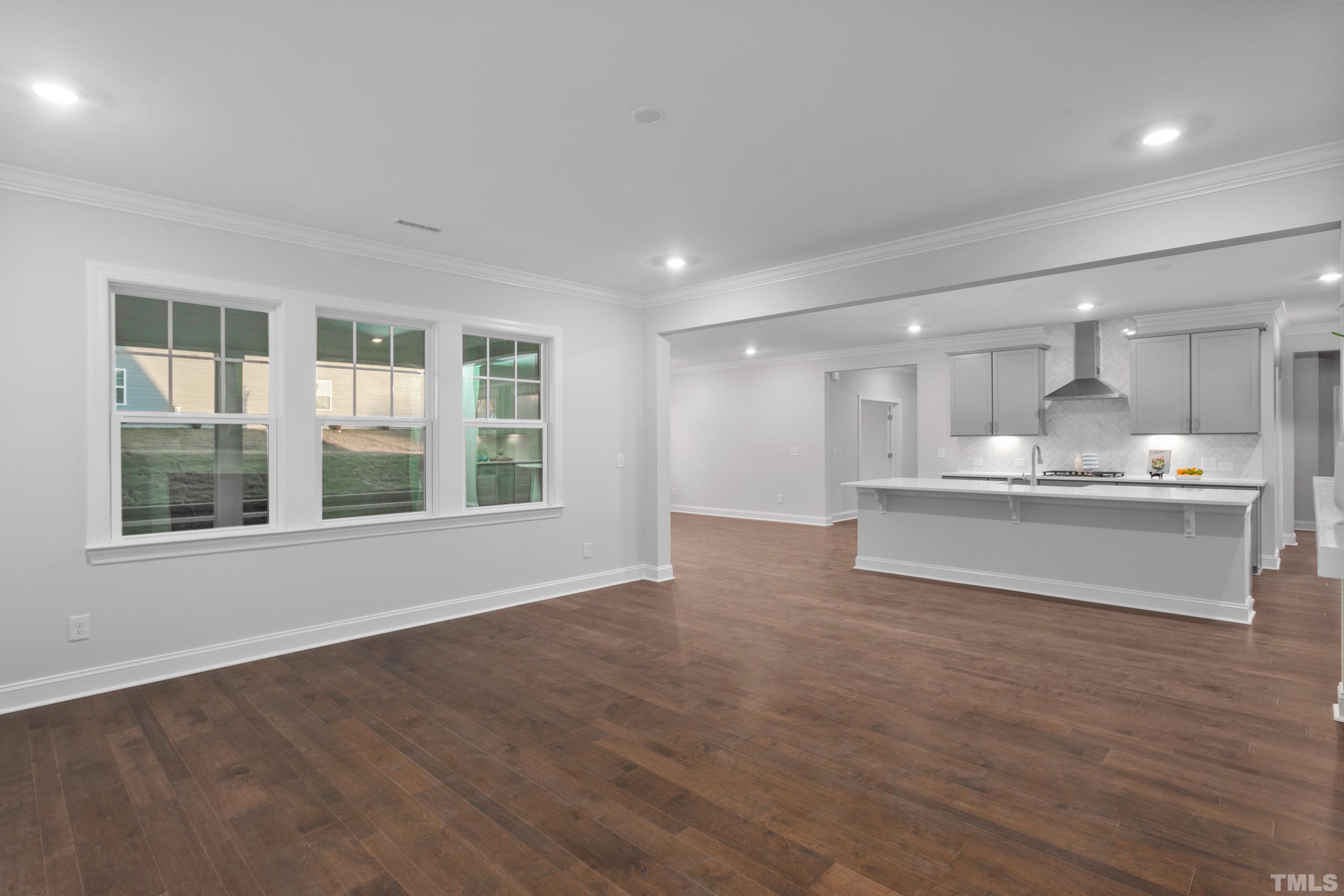 137 English Violet Lane Raleigh, NC 27610 - Photo 13 of 27 a view of kitchen with wooden floor and windows