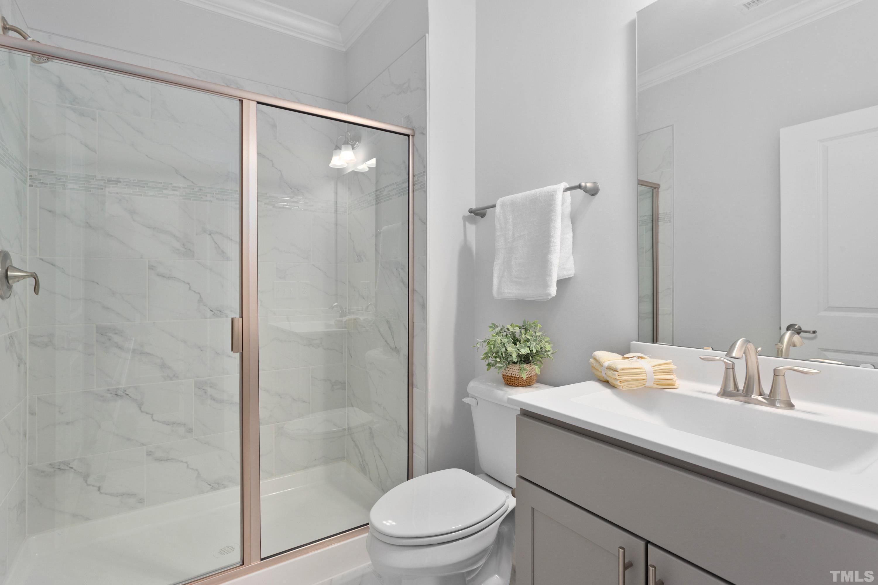 137 English Violet Lane Raleigh, NC 27610 - Photo 18 of 27 a bathroom with a sink a toilet and shower