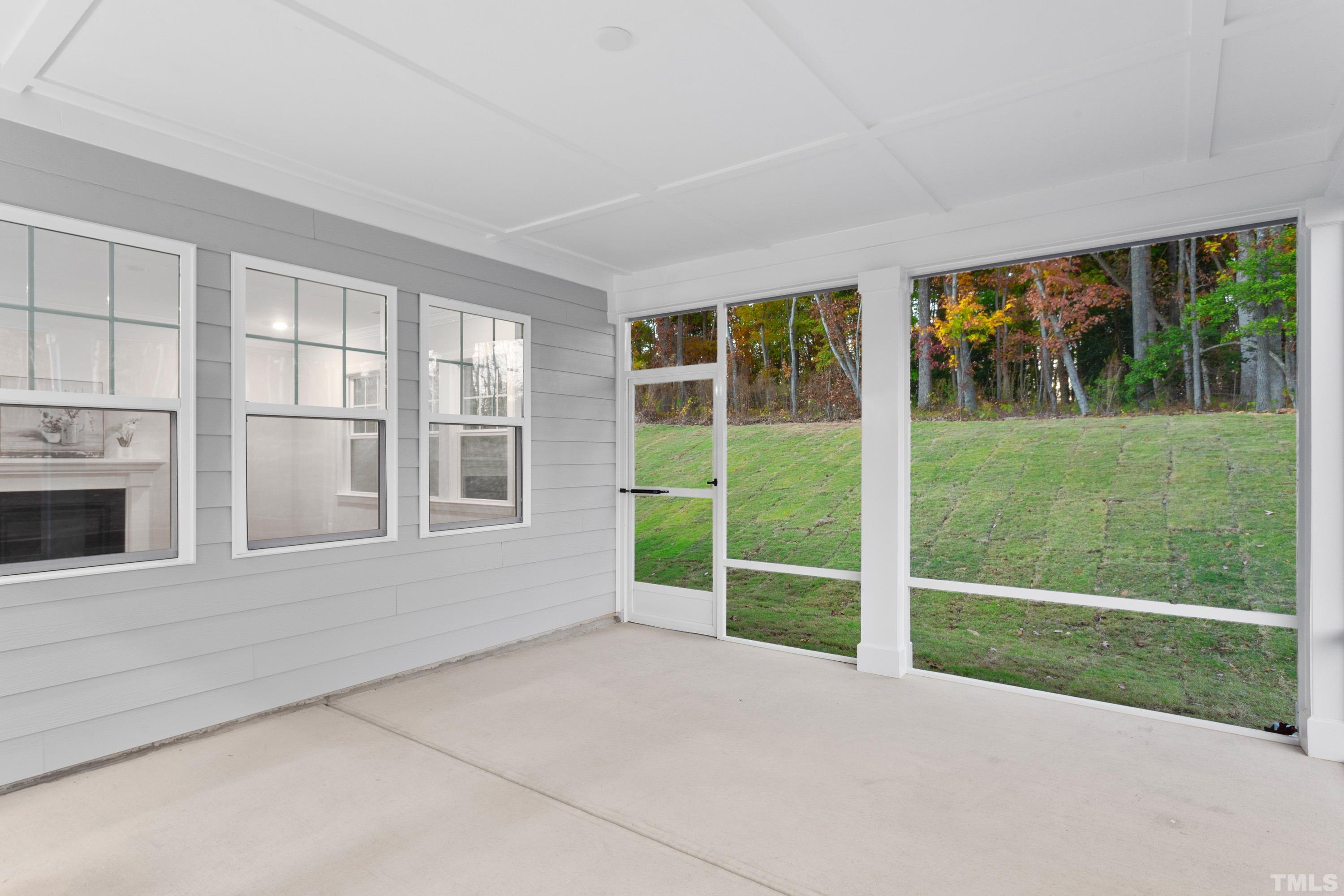 137 English Violet Lane Raleigh, NC 27610 - Photo 21 of 27 a view of an empty room with a fireplace and a window