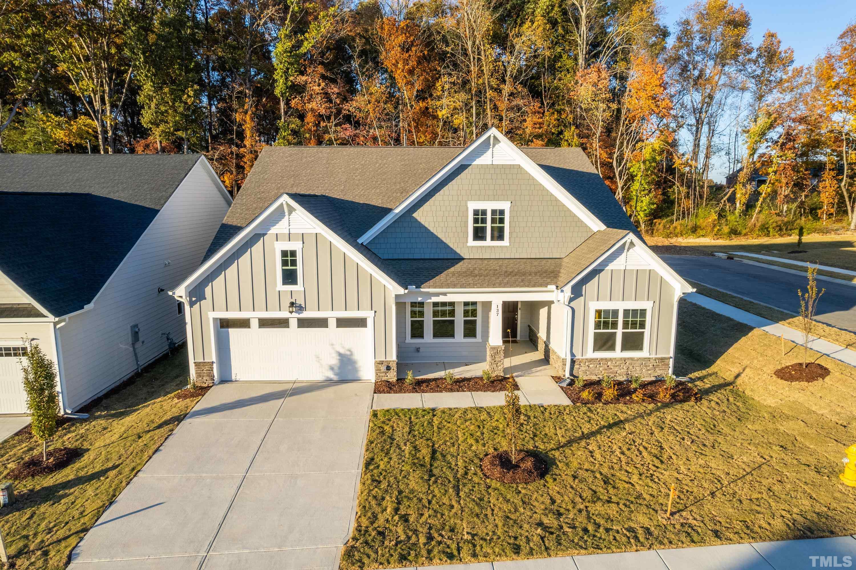 137 English Violet Lane Raleigh, NC 27610 - Photo 27 of 27 a view of a white house with a large windows