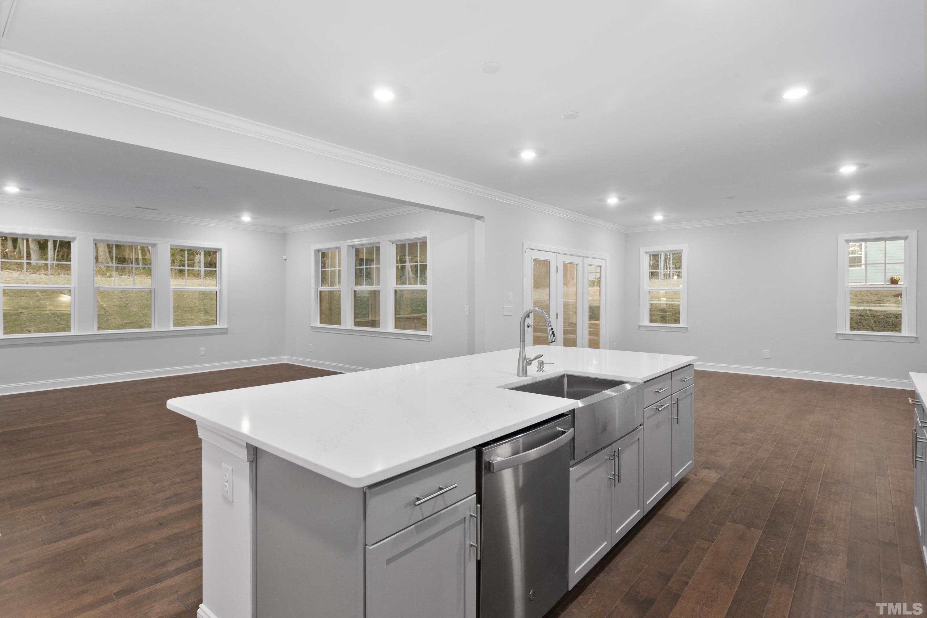 137 English Violet Lane Raleigh, NC 27610 - Photo 5 of 27 a kitchen that has a sink and a table in it