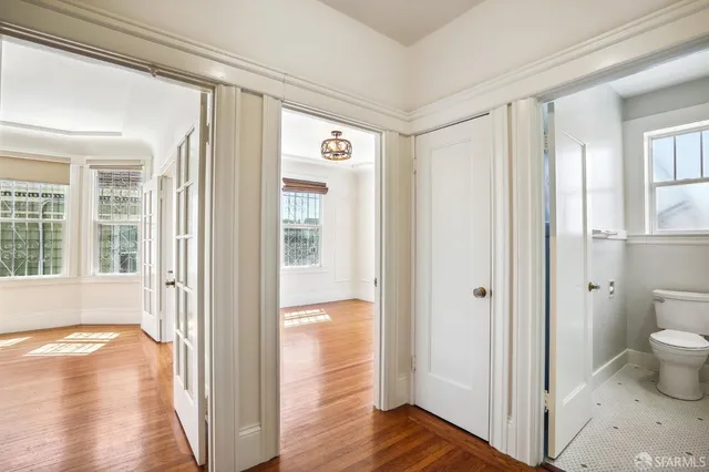 a view of a porch with a floor to ceiling window and glass door