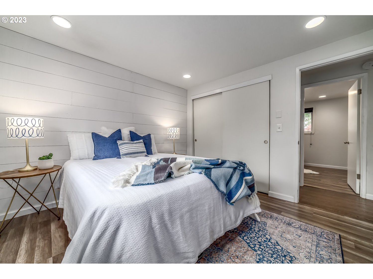 348 U Street Springfield, OR 97477 - Photo 19 of 29 a bedroom with a bed and a walk in closet