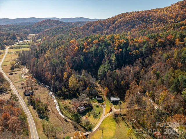 an aerial view of residential house and green space