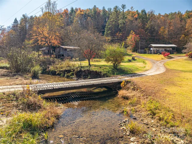 a view of swimming pool with a yard and mountain view