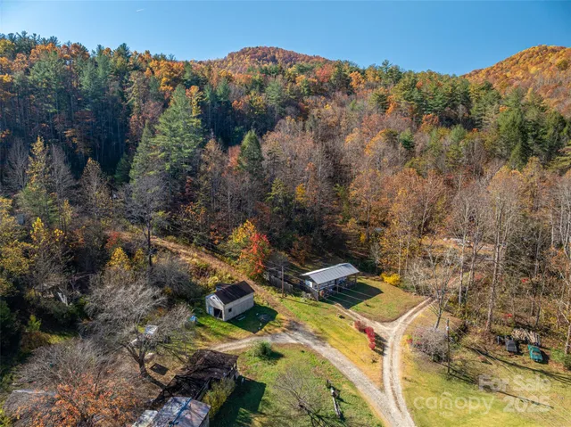 an aerial view of a house with mountain view