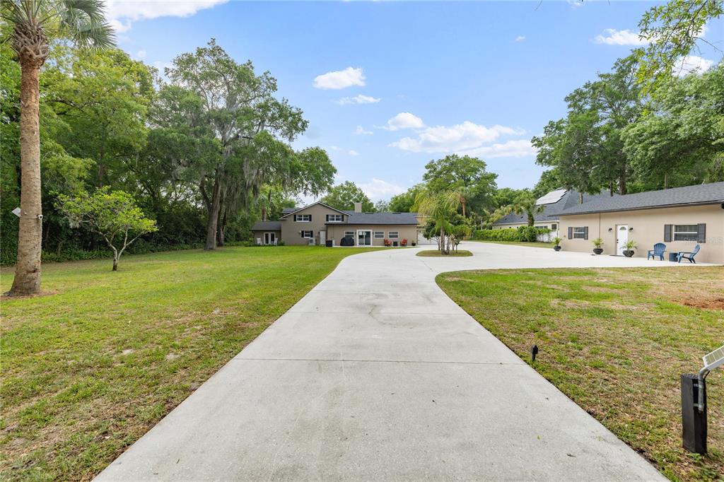 891 Markham Woods Road Longwood, FL 32779 - Photo 52 of 56 a front view of house with a garden