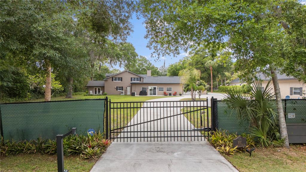 891 Markham Woods Road Longwood, FL 32779 - Photo 53 of 56 a view of a house with backyard and garden