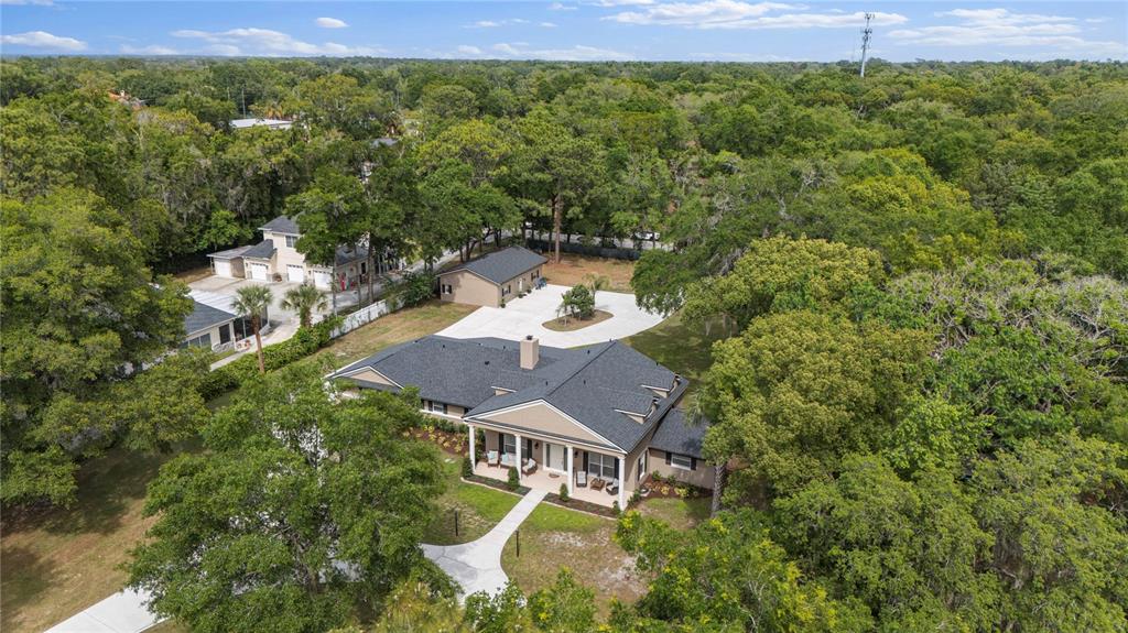 891 Markham Woods Road Longwood, FL 32779 - Photo 54 of 56 an aerial view of a house with a yard