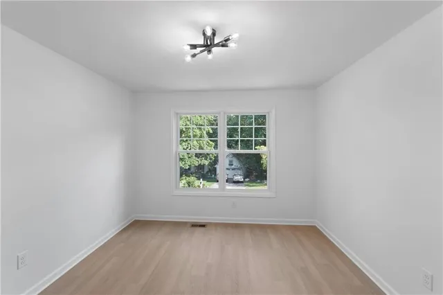 a view of empty room with a ceiling fan