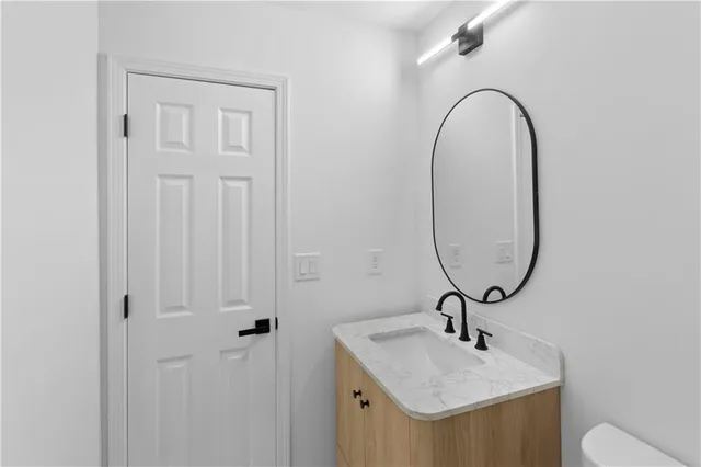 a bathroom with 2 sink and a mirror