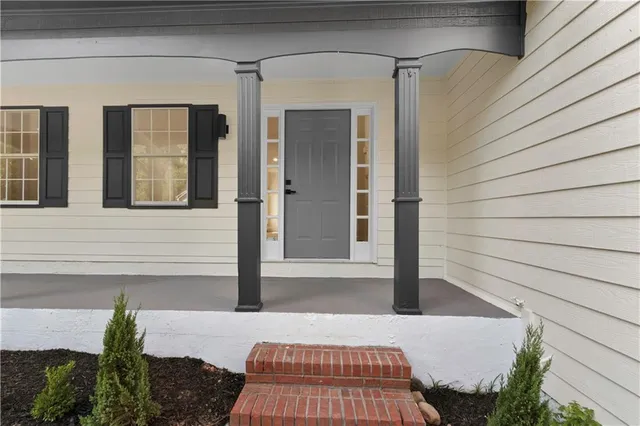a view of a kitchen with a sink and a window