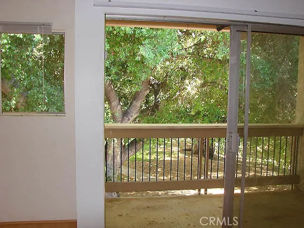 a view of a glass door with a balcony