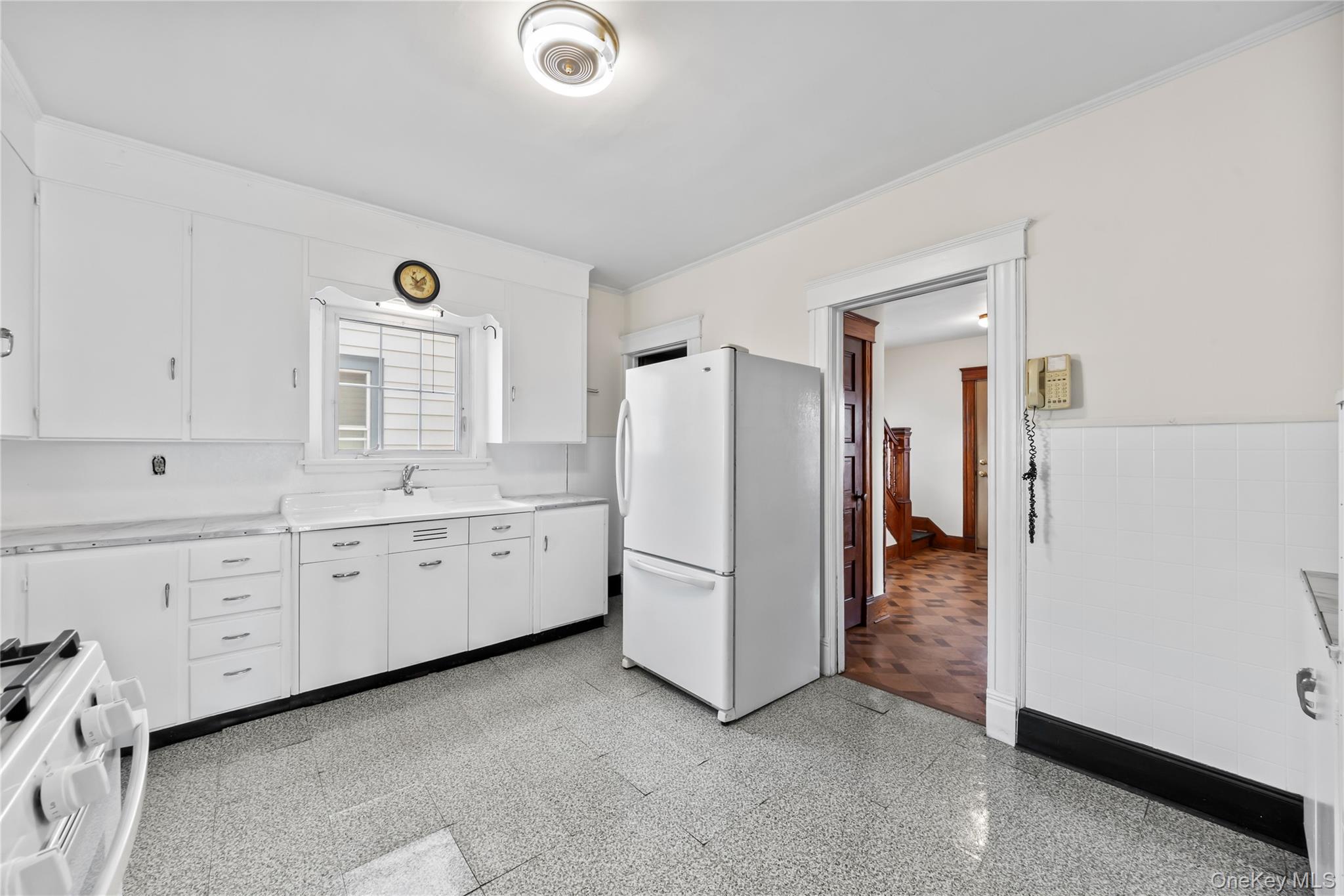 47 Prairie Avenue Suffern, NY 10901 - Photo 11 of 45 a kitchen with granite countertop white cabinets and white appliances