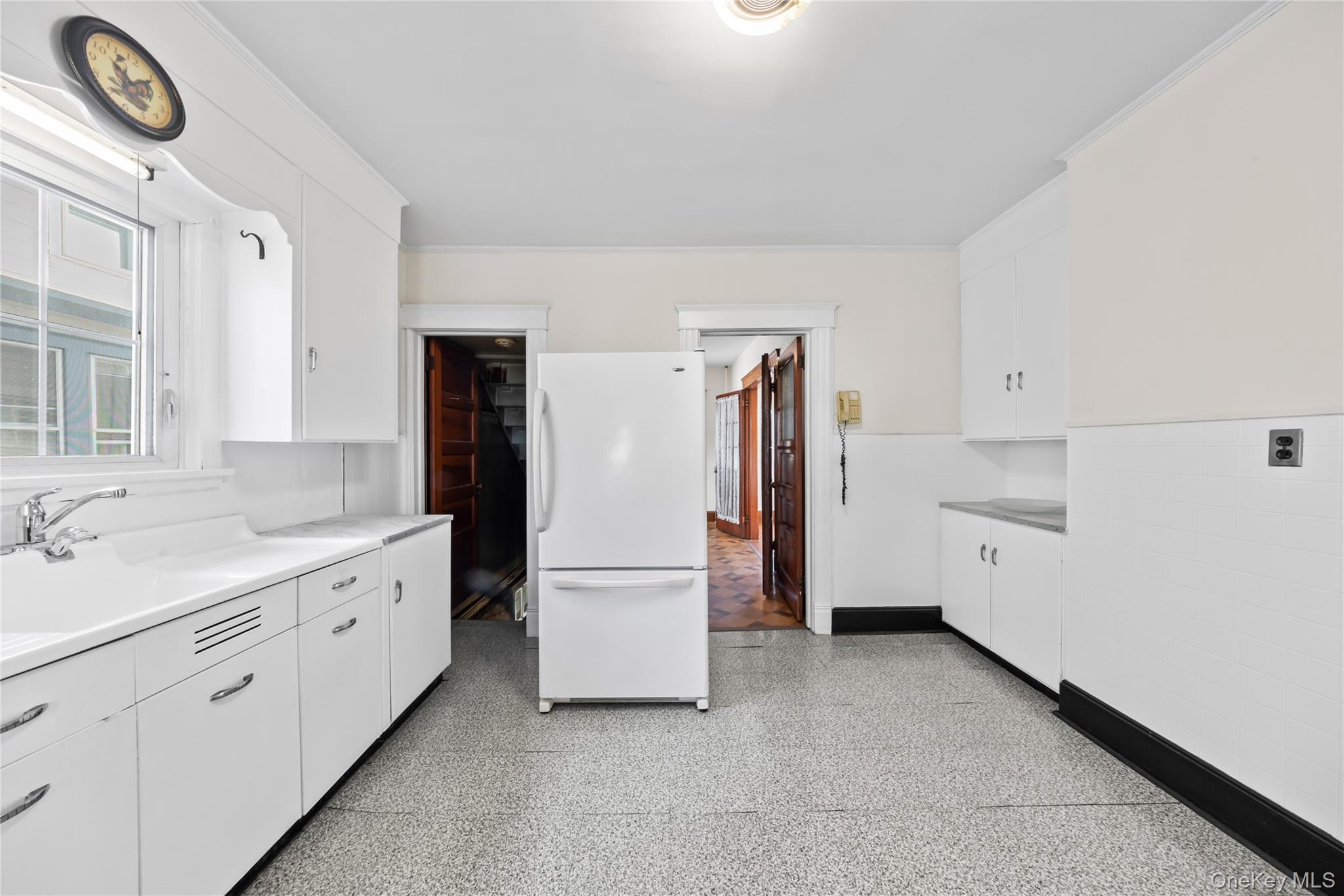 47 Prairie Avenue Suffern, NY 10901 - Photo 12 of 45 a kitchen with white cabinets and refrigerator