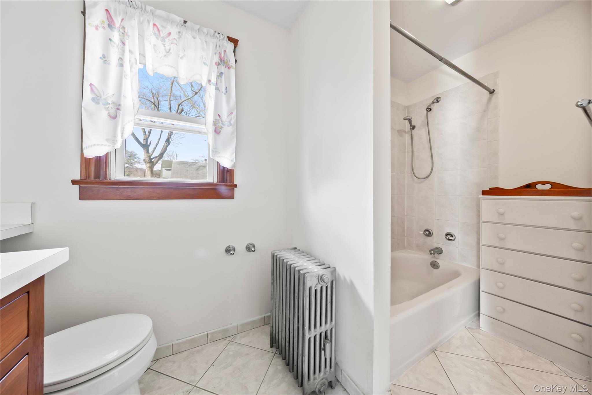 47 Prairie Avenue Suffern, NY 10901 - Photo 14 of 45 a bathroom with a bathtub a toilet and a shower